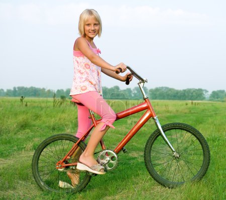 Young Little Girl On Bicycle