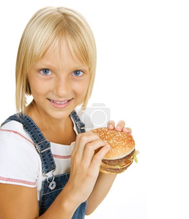 Happy Little Girl Eating Hamburger