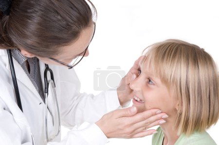 Doctor Examining Little Child Girl