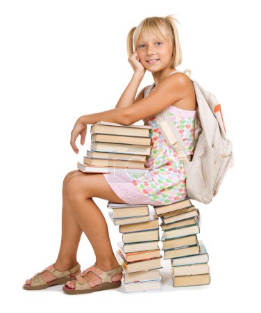 Education Concept. School Girl Sitting On The Stack Of Books