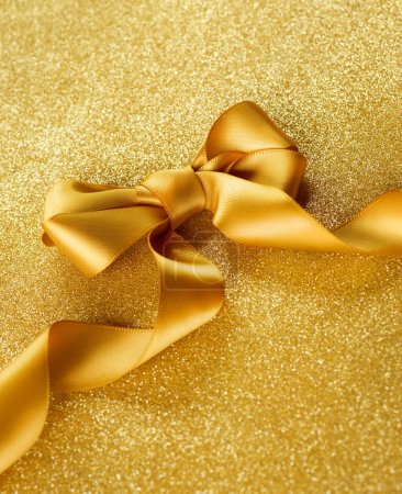 Gold Ribbon Bow on a Blinking Background Holiday Background.Gree