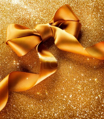Gold Ribbon Bow on a Blinking Background Holiday Background.Gree