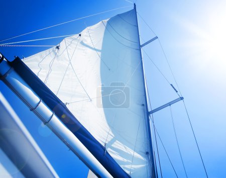 Sails over blue Sky. Yachting concept.Sailboat