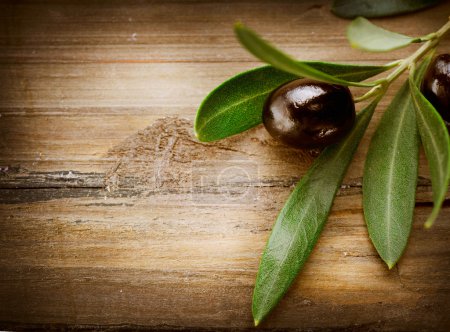 Olives over Wood Background