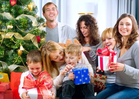 Happy Big family holding Christmas presents at home.Christmas tr