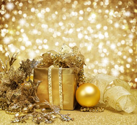 Christmas Decoration over Glittering Golden Background