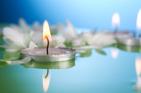 Burning Floating Candles And Flowers