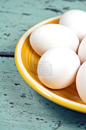 Eggs on a yellow plate