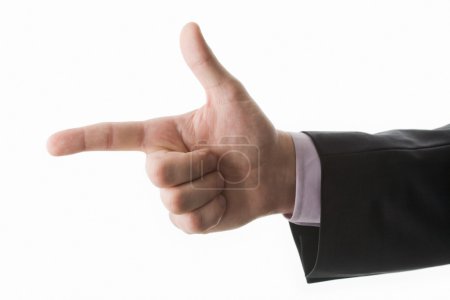 Photo of human hand with forefinger pointing straight