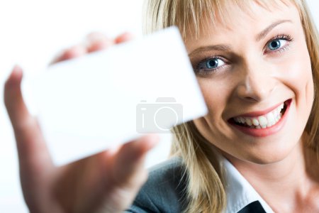 A beautiful woman holding a business card