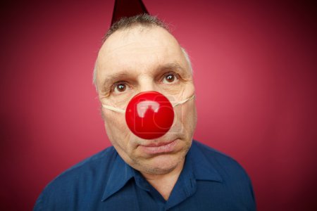 Unhappy man with red nose