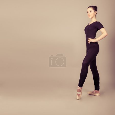 Young caucasian brunette ballerina girl
