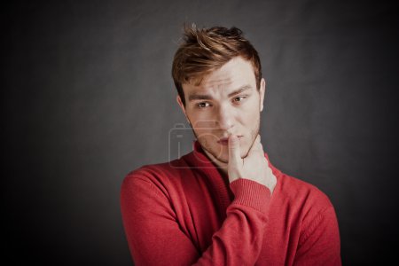 Portrait of young man thinking