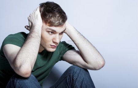 Young man with depressed expression