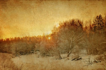 Sunset in winter field in grunge style