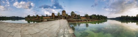 Panorama with road to Angkor Wat Temple in evening time