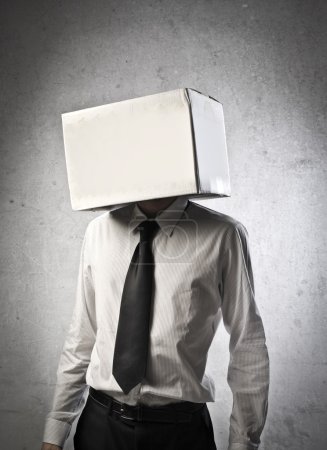 Young businessman with carton covering his head