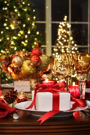 Festive table setting with red ribbon gift