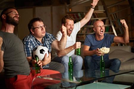 men watching soccer