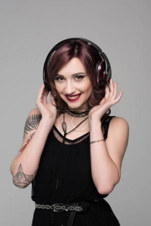 young woman listening to music in headphones