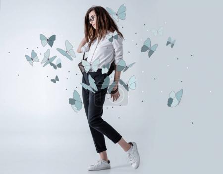 Stylish hipster woman with butterflies