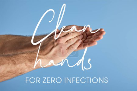 cropped view of man washing hands isolated on blue, clean hands for zero infections illustration