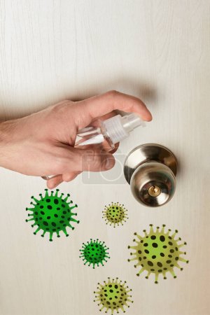 cropped view of man disinfecting door handle with antiseptic, bacteria illustration