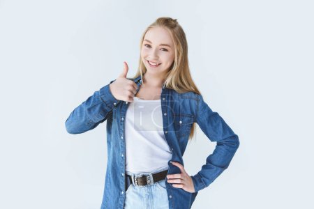 teenage girl showing thumb up