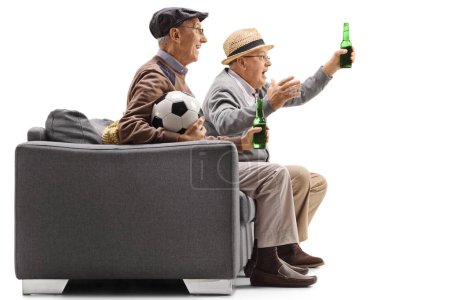 seniors watching football on television and having a beer