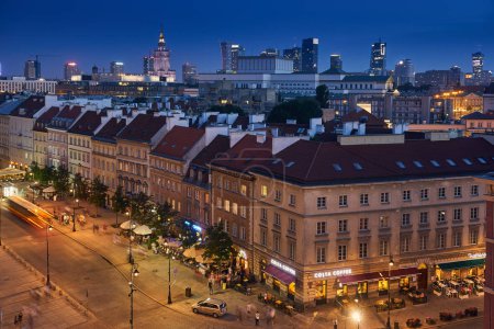 Warsaw, Poland - August 11, 2017: Beautiful panoramic night view over the roofs of the Old Town to the Center of Warsaw, the Palace of culture and science (PKiN), modern skyscrapers and Krakowskie Prz