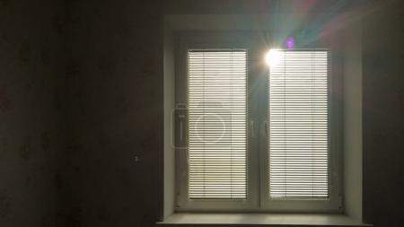 Sunlight behind vertical blinds. 