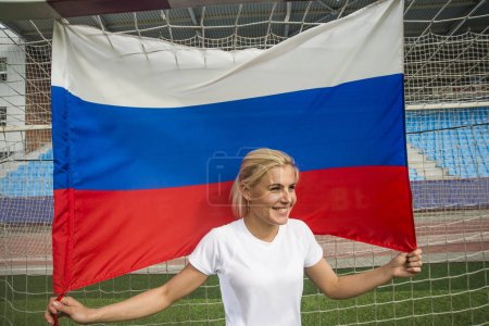 girl holding  in hands Russian flag  
