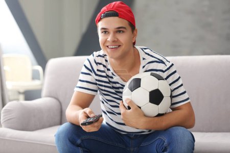 Teenager watching football