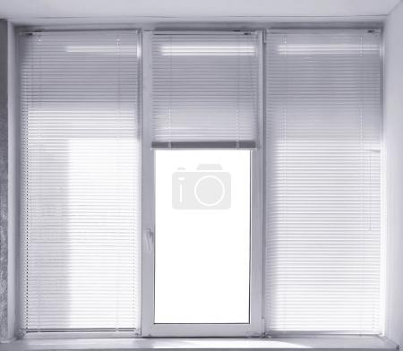 Window with white blinds