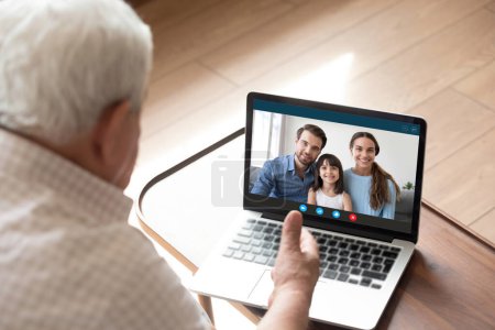 Mature grandfather have online talk with smiling relatives