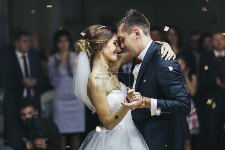 Just married looks romantically while dancing 