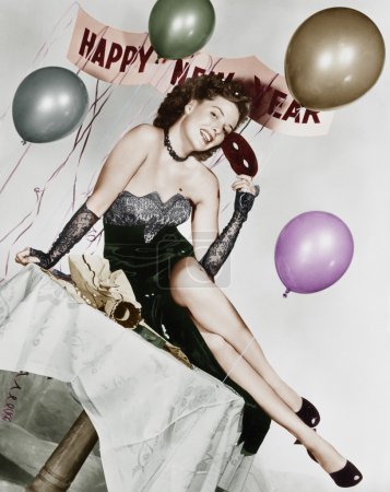 Young woman sitting on a table with balloons and sign