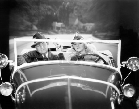 Couple driving a car