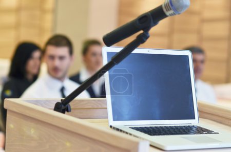 Laptop on conference speech podium