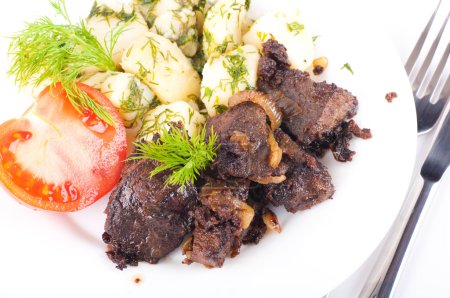 Fried pork liver with tomatoes and potatoes
