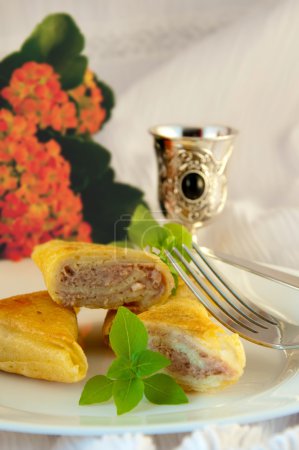 Fritters with meat and a basil, natural flowers