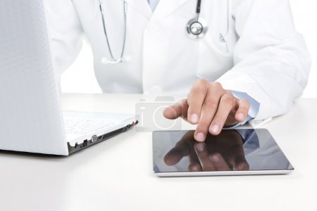 Doctor working on a digital tablet