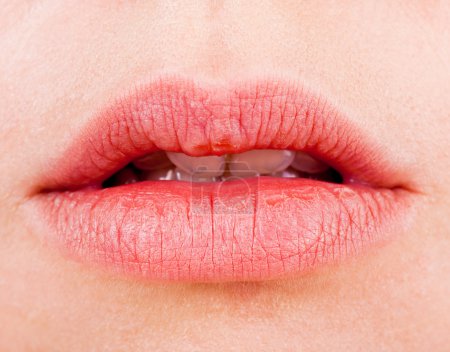 Natural women's sensual lips closeup