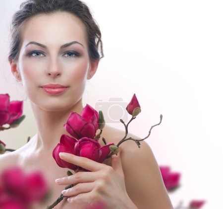 Beautiful Healthy Woman with Spring Flowers. Spa