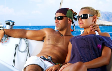 Beautiful Couple resting on the Yacht