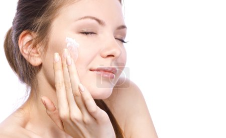 Applying cream for face