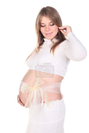 Pregnant woman in bow on a bump