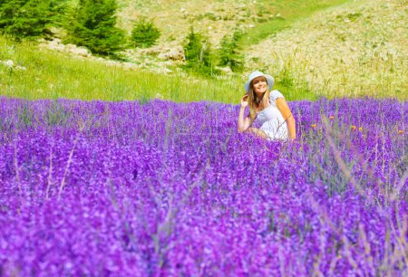 Beautiful woman on lavender meadow